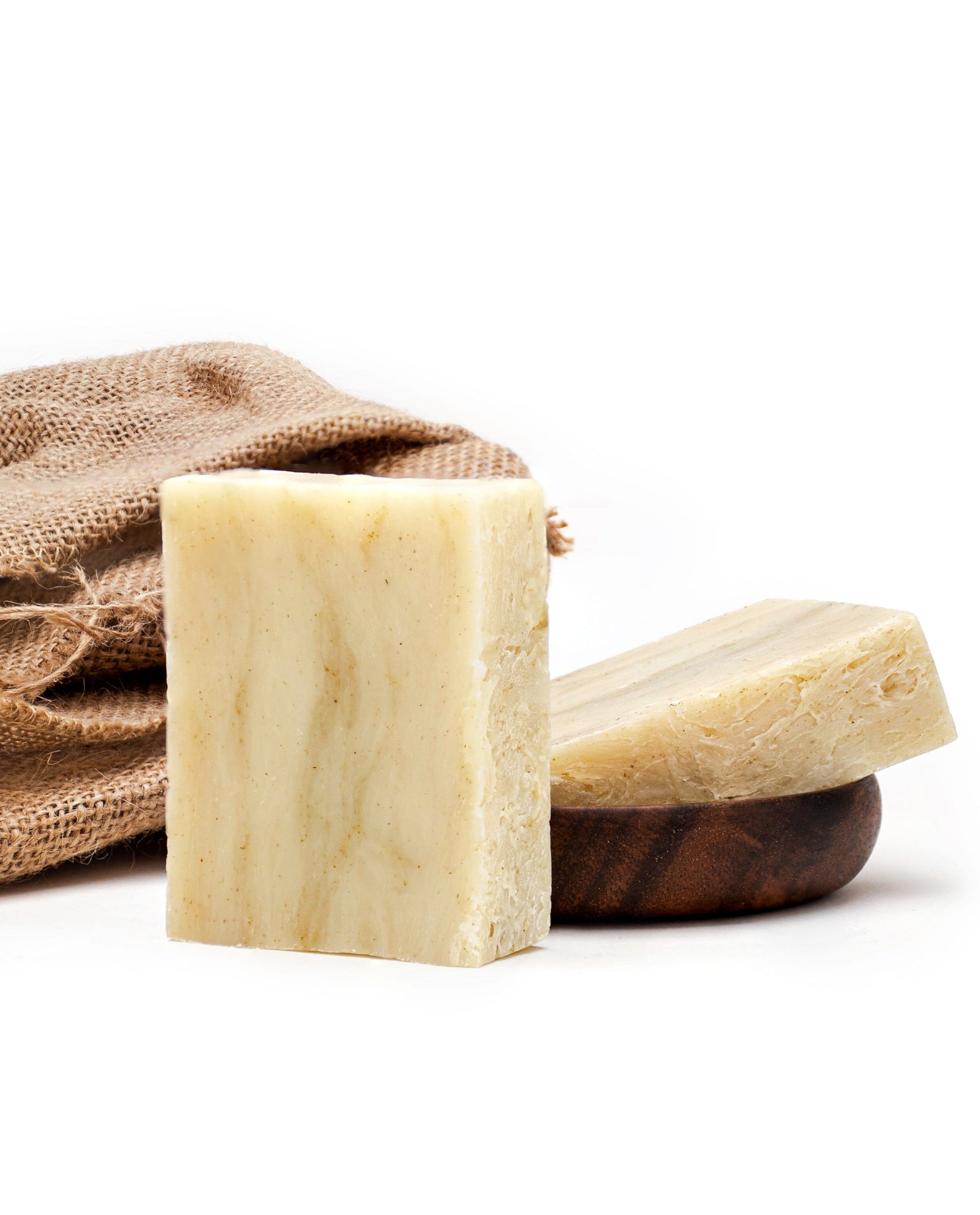 Two T2 tea tree soap bars with a woven sisal sack and wooden soap dish, Iron Lion Soap